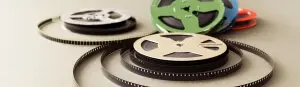 Vintage collection 8 mm cinema film reel. Retro design colorful celluloid accessories for home video projector.